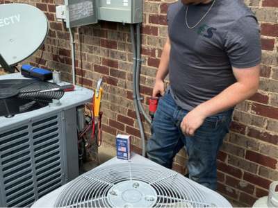 Engle Services HVAC Technician installing an AC unit in Talladega, Alabama